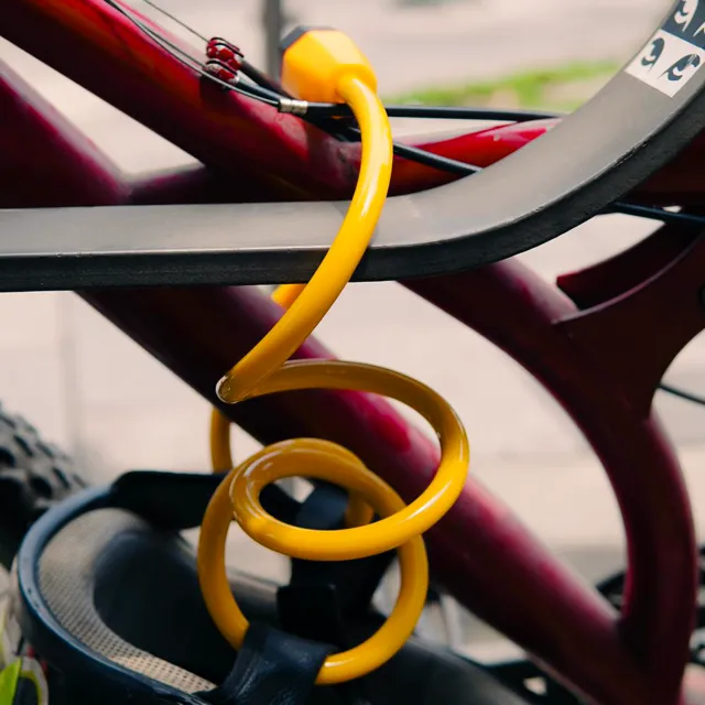 Yellow coil lock on a bicycle