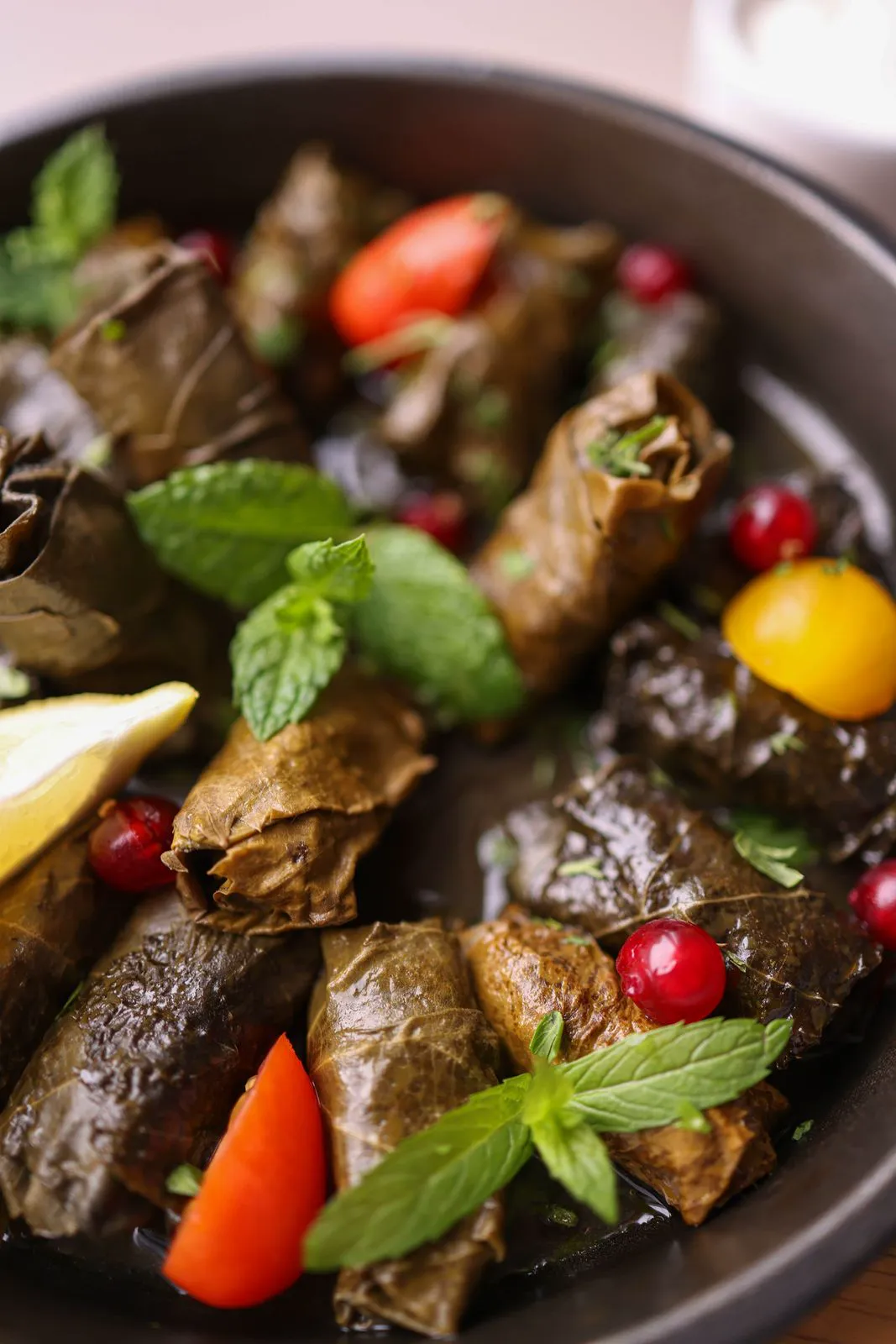 Stuffed grape leaves with mint, lemon and tomatoes