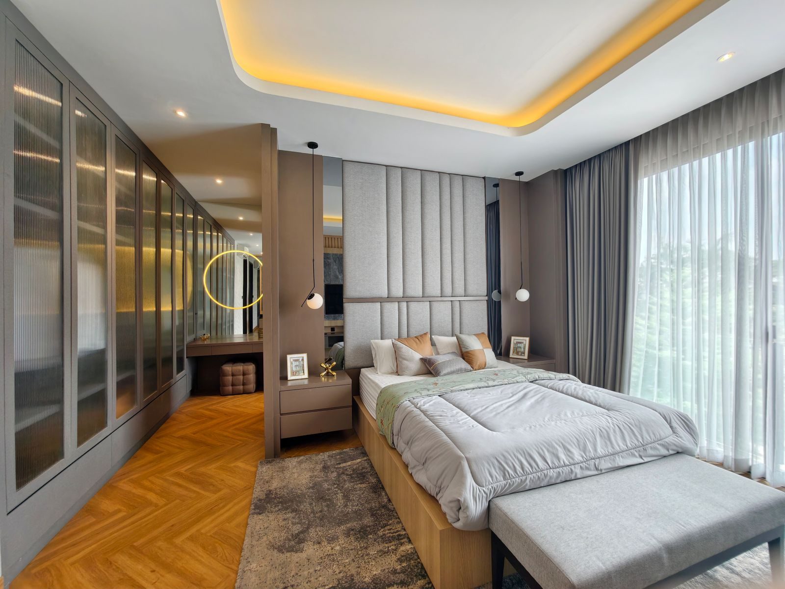 Bedroom with a honey toned chevron floor