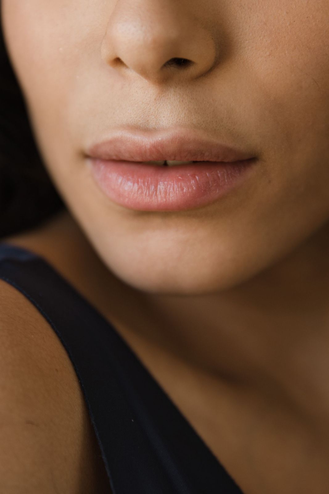 Close-up of soft, even-toned lips on deeper skin
