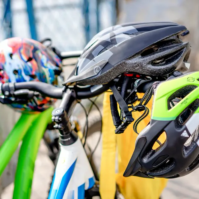 Helmets resting on handlebars