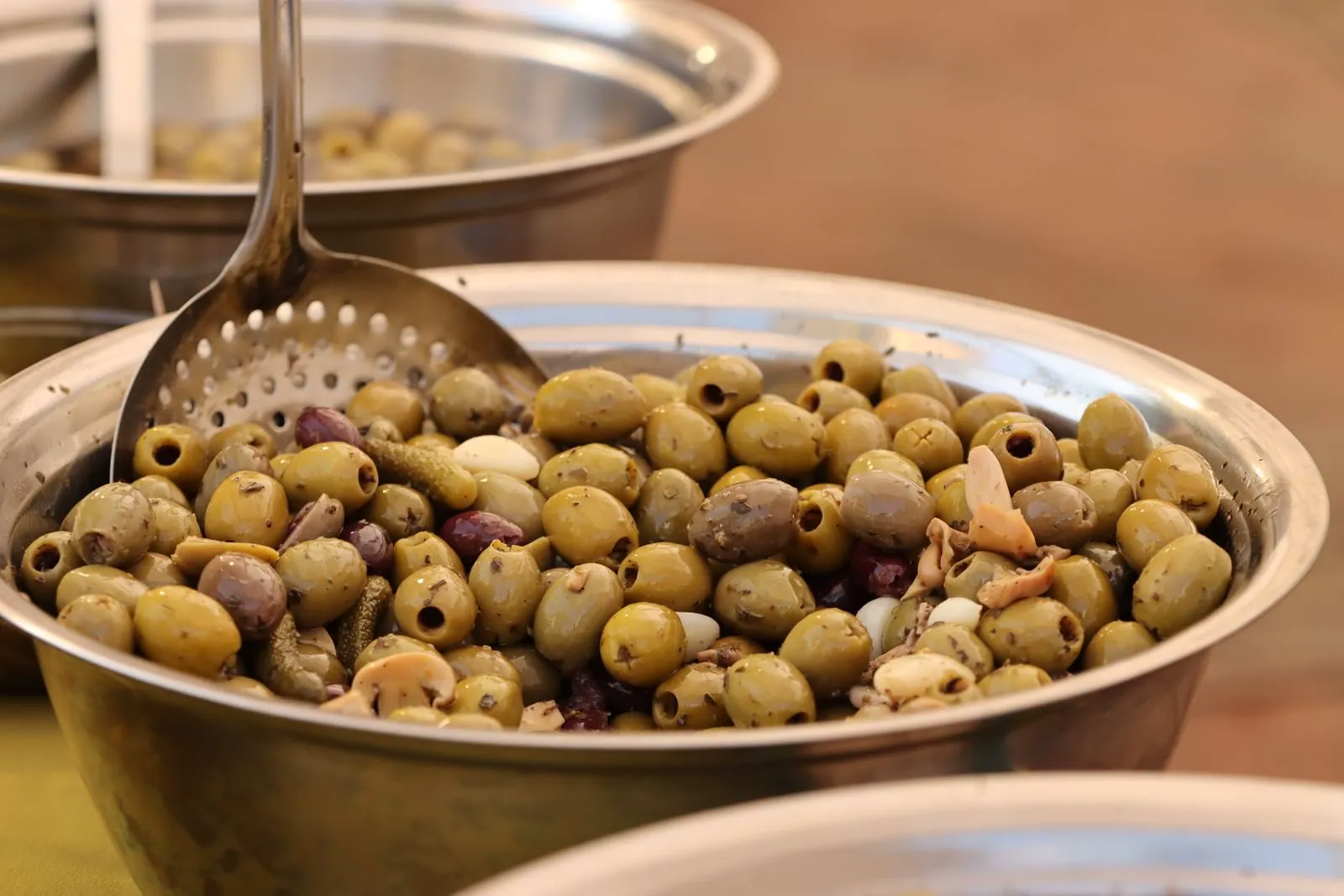 Mixed marinated olives in a steel bowl